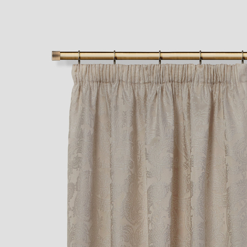 Full Stop - Extendable Curtain Pole with rings and pair of end finials in Antique Brass